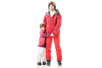 Dad and daughter holding hands and standing in snowsuits isolated on white