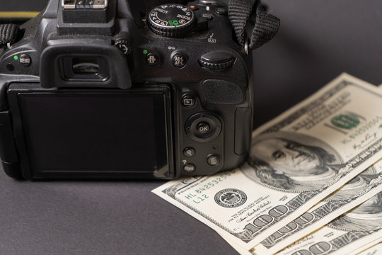 old photo camera and money