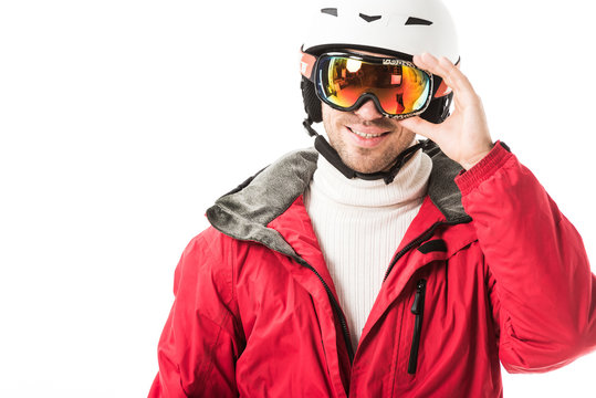 Adult Man In Red Ski Jacket And Helmet Putting On Goggles And Smiling Isolated On White