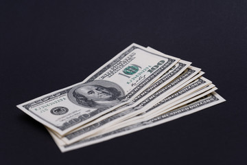 Dollars on black background