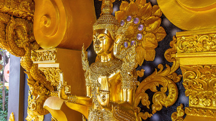 Golden Buddha in a magnificent church   at Wat Prathat Doi Prachan, Lampang Thailand NOV 18 2018