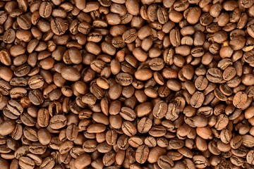 Roasted brown coffee beans pattern, background, top view