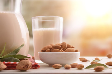 Alternative milk of almonds in rustic kitchen close up