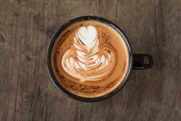 Piccolo Latte art in a cup topping beautiful heart art from milk