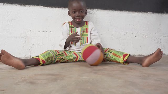 Little Black African Boy Plays with Ball in 4K
