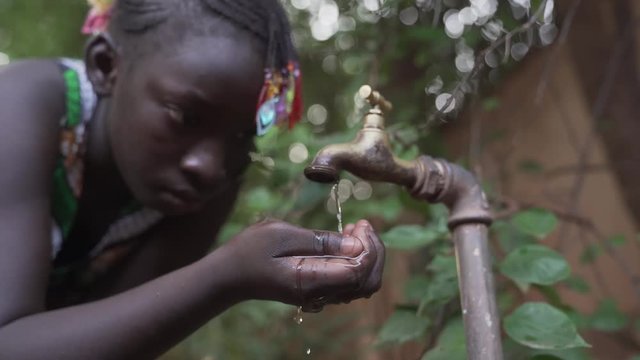 African Girl Drinks Water in Slow Motion HD