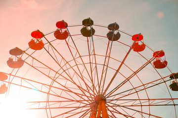 Ferris wheel at sunset in the evening
