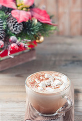 cup of hot cocoa with marshmallows on wooden background