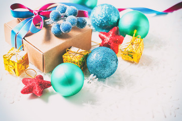 Christmas gift box with ribbon and christmas decoration on a white background
