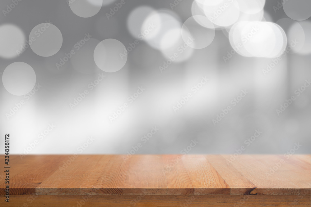 Canvas Prints wooden desk with blurred light bokeh abstract background