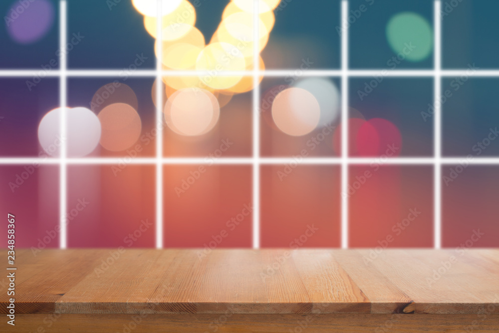 Canvas Prints wooden desk with blurred light on road in city with bokeh abstract background