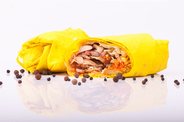 Shawarma sandwich gyro fresh roll of lavash (pita bread) chicken beef shawarma falafel RecipeTin Eatsfilled with grilled meat, mushrooms, cheese. Traditional Middle Eastern snack. On white background