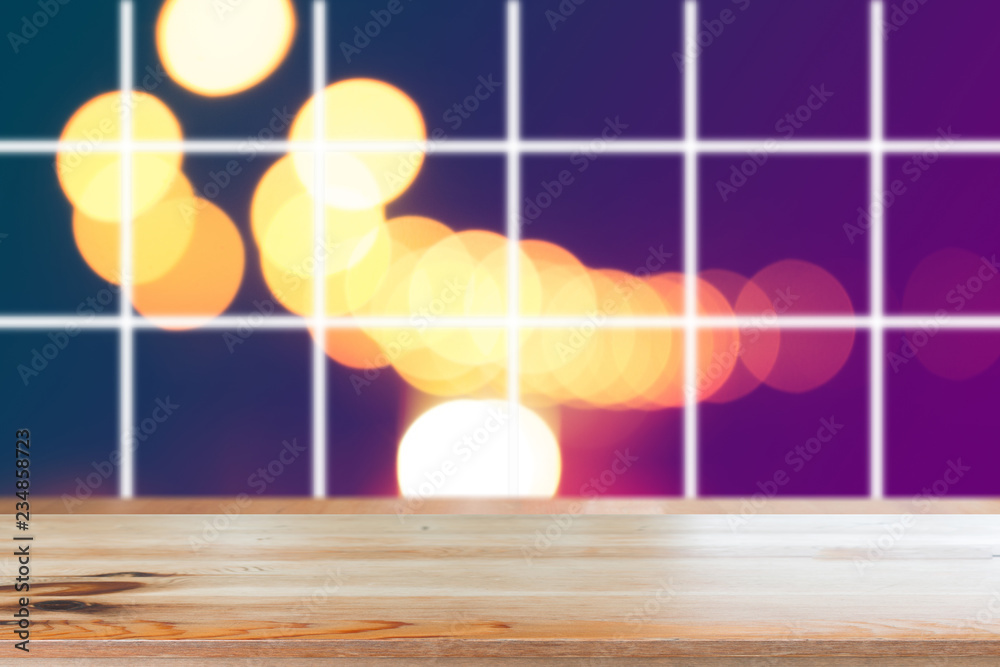 Canvas Prints wooden desk with blurred light on road in city with bokeh abstract background