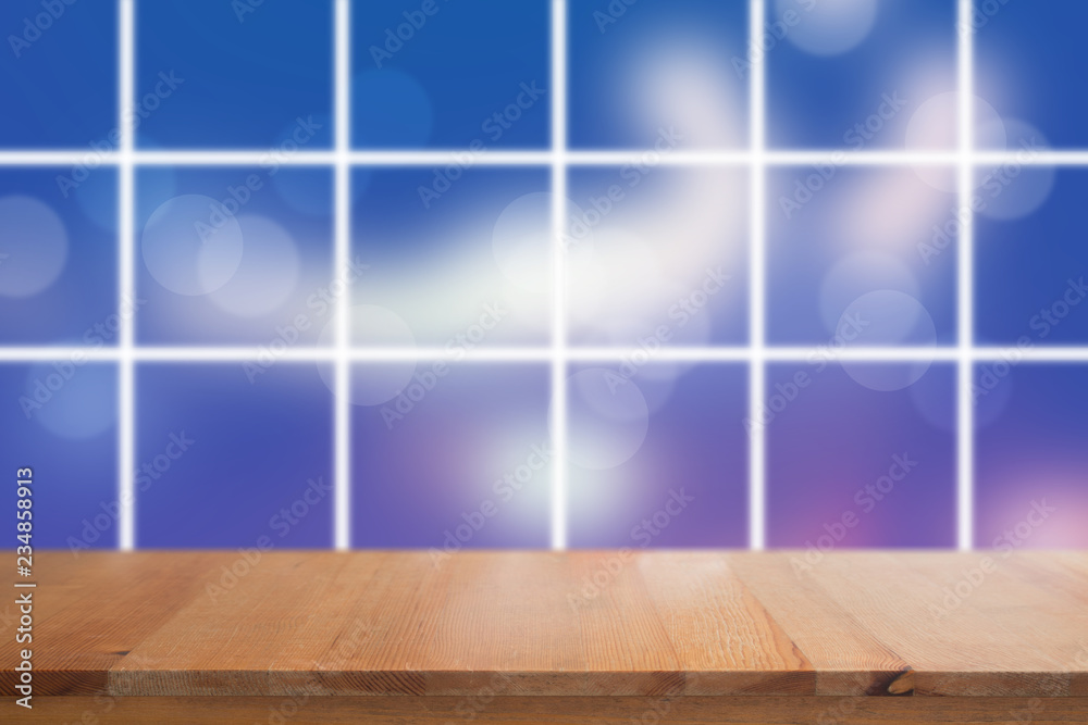 Canvas Prints wooden desk with blurred light on road in city with bokeh abstract background