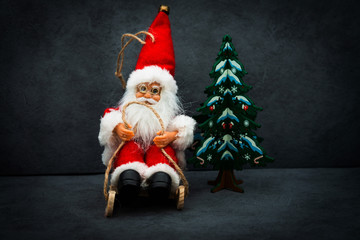Santa Claus figurine christmas decoration over wooden background