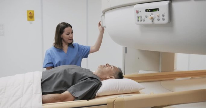 Medical Examination With MRI Magnetic Resonance Imaging Machine In Clinic