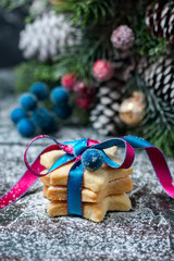 Homemade star shaped cookies on a wooden background. Christmas decoration