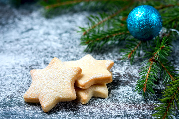 Homemade star shaped cookies on a wooden background. Christmas decoration