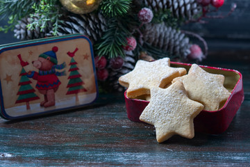 Homemade star shaped cookies on a wooden background. Christmas decoration