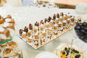 Different kinds of baked sweets on a buffet