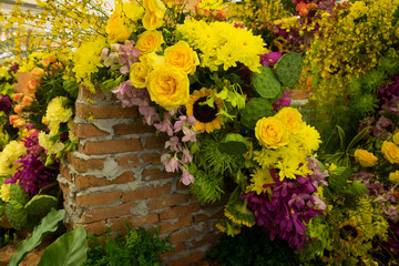 Fototapeta na wymiar Gardening decorations with colorful flower and brick.