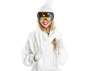 Happy woman in warm white knitted clothes smiling isolated on white