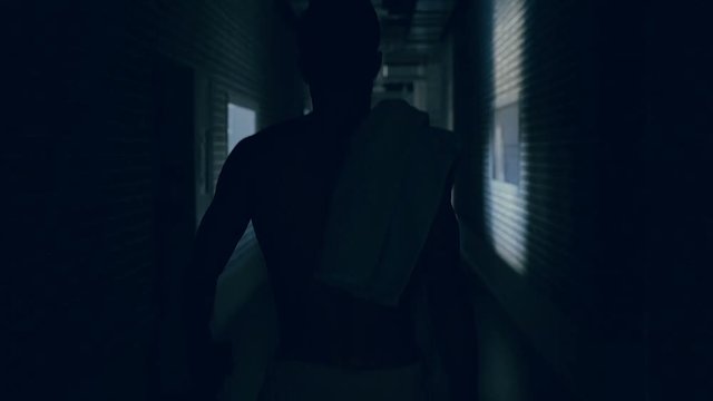 Boxer walking at the hallway after training.