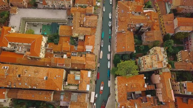 Drone video - Aerial view of Venice Italy. Aerial cityscape. Camera follow the boat. Professional color grade 4K UHD footage