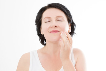 Fototapeta premium Beauty middle age woman face portrait. Spa and anti aging concept Isolated on white background. Plastic surgery and collagen face injections. Wrinkles and menopause. Mock up. Copy space