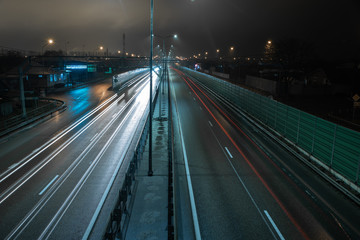 Fototapeta na wymiar Traffic on the night highway