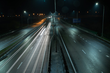 Fototapeta na wymiar Traffic on the night highway