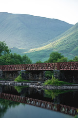 Old metal bridge among scottish scenery, Scotland, UK.