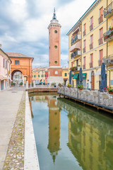 Clock tower in the streets of Comacchio in Italy