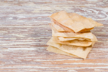 homemade chips on wooden background