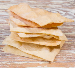 homemade chips on wooden background