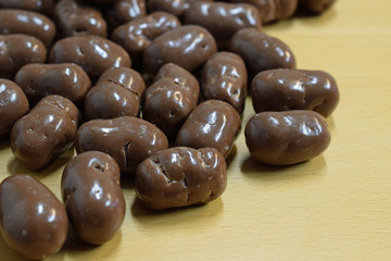 Delicious puffed maize chocolate candies. Close up image with copy space.