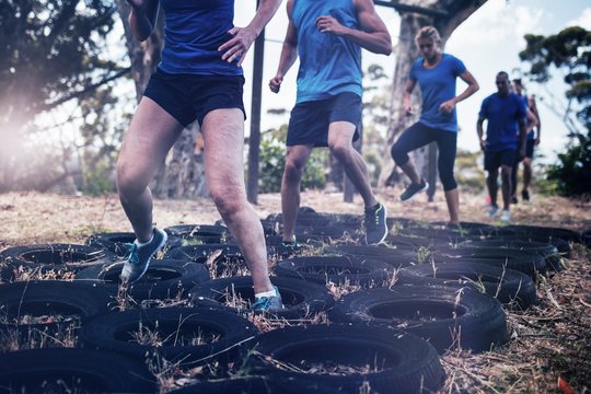 People receiving tire obstacle course training