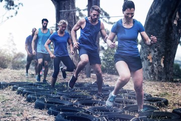 People receiving tire obstacle course training