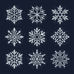 Snowflakes collection. Vector illustration of silver shining snowflakes. Isolated on the black background.