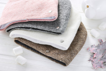 Knitted hats, close-up on a white background