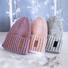 Knitted hats, close-up on a white background