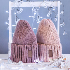 Knitted hats, close-up on a white background