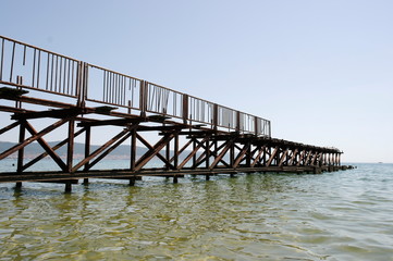 Old wooden pier with metal fences
