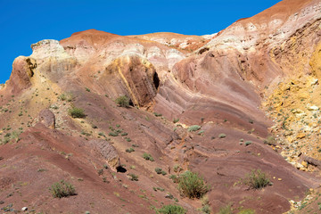 Hill of clay of different shades in the valley of Kyzyl-Chin