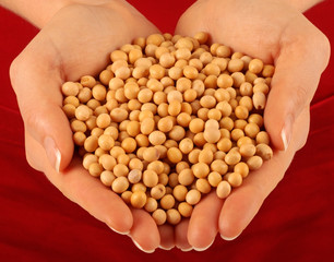 WOMAN WITH HANDFUL OF SOYA BENAS