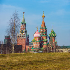 Fototapeta na wymiar Zaryadye Park landscape. Kremlin wall, Spasskaya tower and Saint Basil's Cathedral in early spring sunny day. Moscow, Russia.