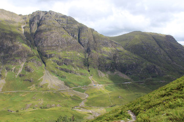 Fototapeta premium View of the famous Glencoe pass and A82 road in the Highlands of Scotland, from high above, in the summertime.