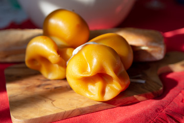 Smoked Fresh South Italian traditional cow or cow and sheep semi-soft cheese Scamorza ready to eat