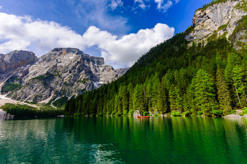 Lake Braies (also known as Pragser Wildsee or Lago di Braies) in Dolomites Mountains, Sudtirol, Italy - Europe. Romantic place with typical wooden boats on the alpine lake.