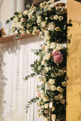 Floral decoration on the wedding ceremony by the restaurant. Pink and white color of rose. Elegant decor on charming wedding